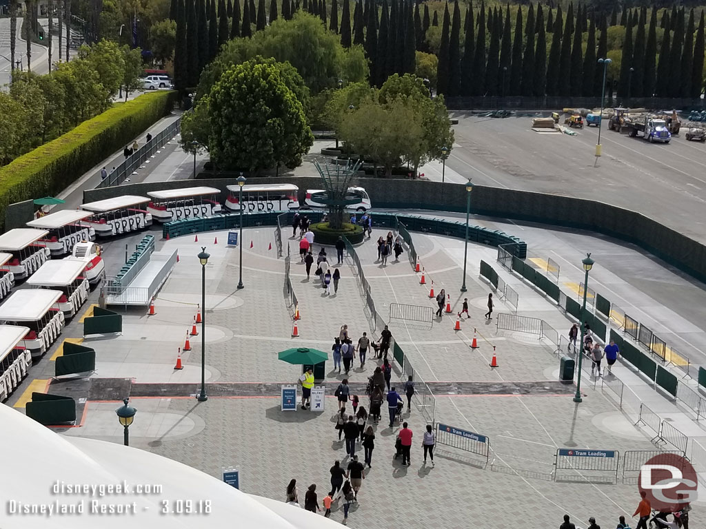 A wider view of the tram stop.  The barriers on the right are for an extended queue for security.  The tram area on the left is for drop off only.