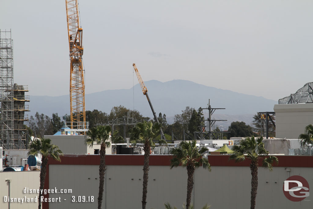 More of the village rising up above the roofline.