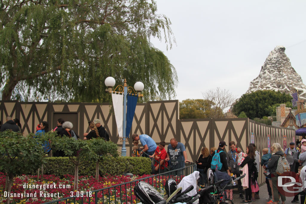 The queue for Casey Jr spills out to the walkway since the walls take up much of the queue space.