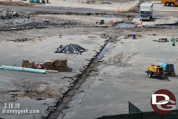 The concrete in the former drainage ditch/path has been removed.