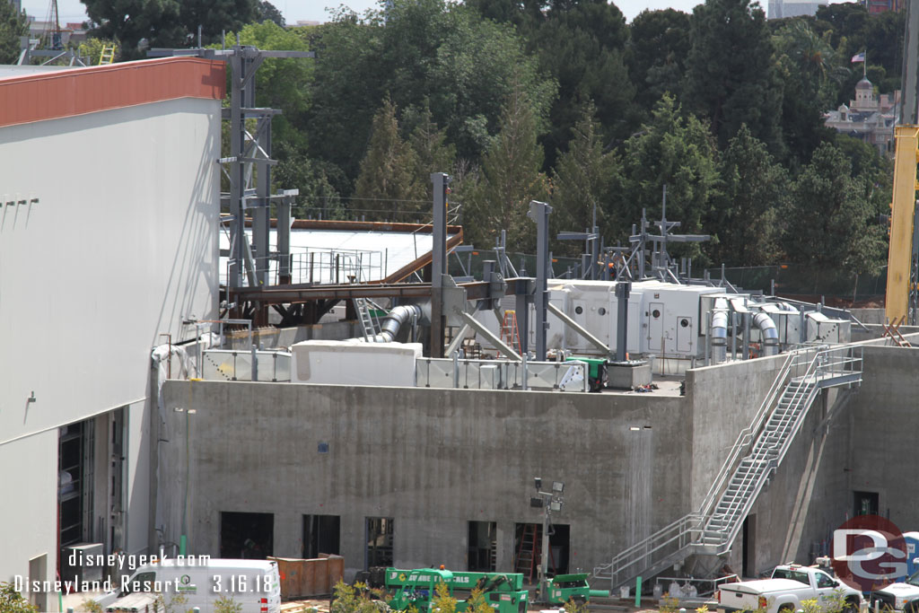 New steel is being installed on top of the concrete building as the rock structure expands in that direction.