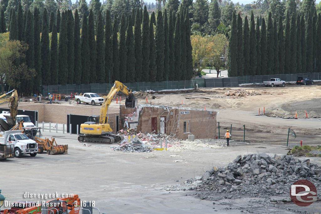 Beyond the building that is being taken apart you can see they have removed the former exit roadway and gates.