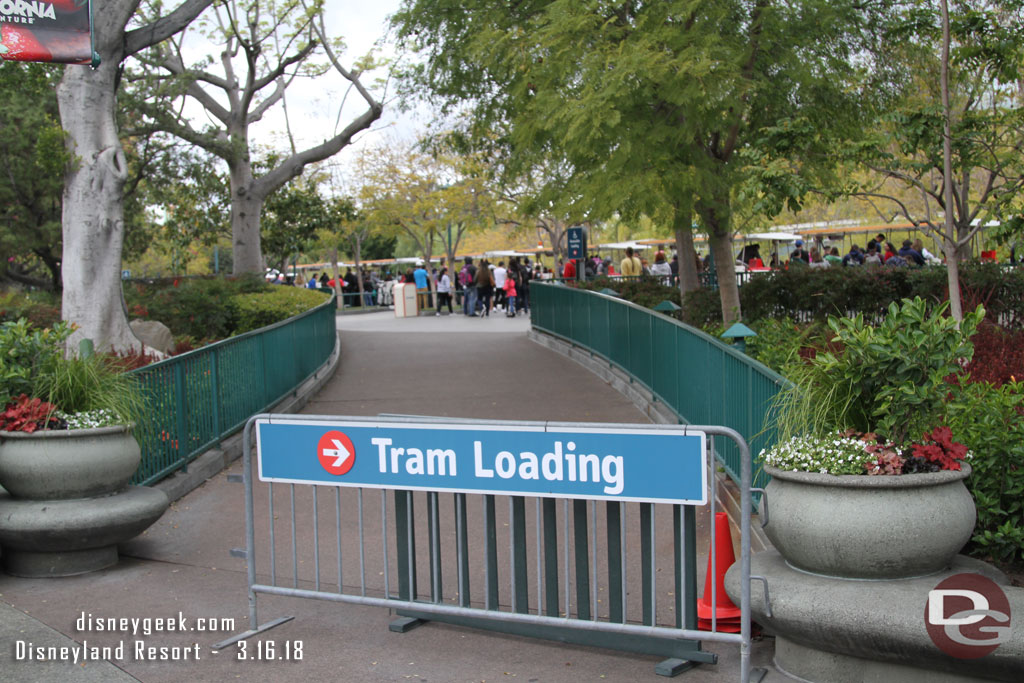 Tram loading signs directing you to the side nearest the park.