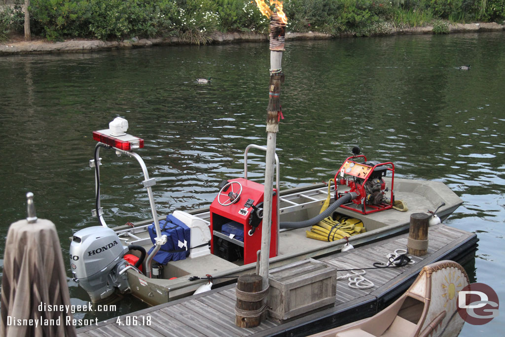 The emergency boat for Fantasmic was docked near the canoes.