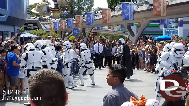 And through Tomorrowland. They stop to check the crowd.