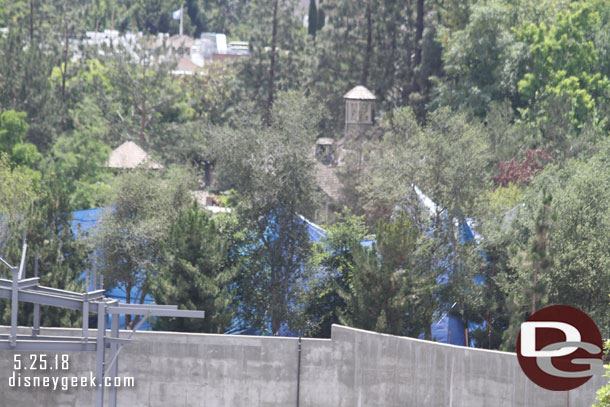 The blue tarp is still up.