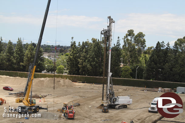 Here you can see the crane has a rebar column that is being lowered into a recently drilled hole.