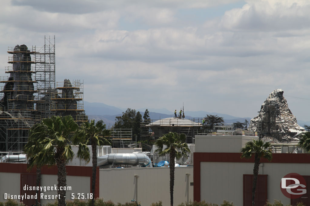 A crew working on the roof of a structure.