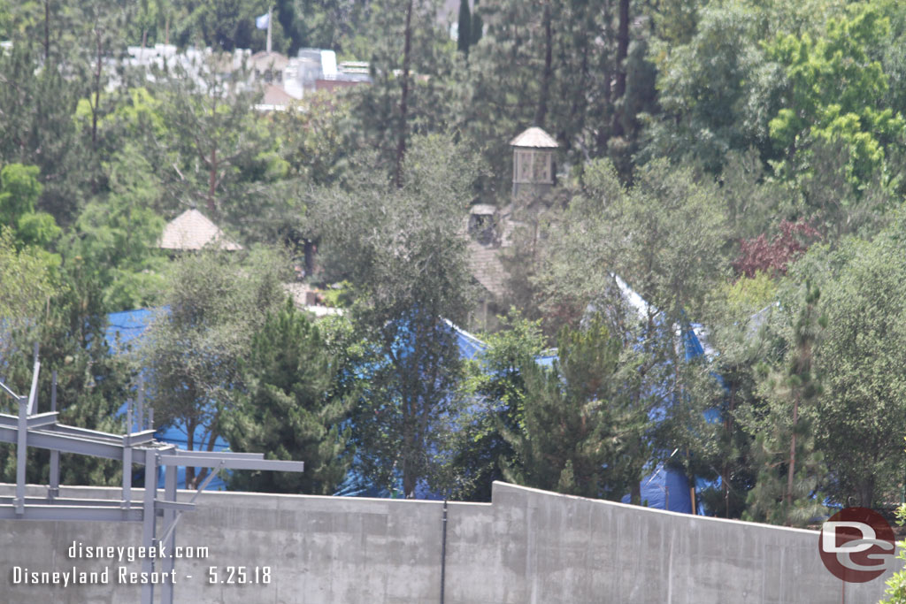 The blue tarp is still up.