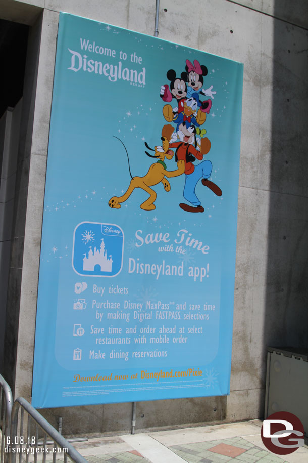 A sign for the Disneyland App as you near the security check point.