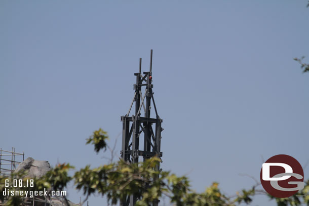 A new structure visible over the trees.