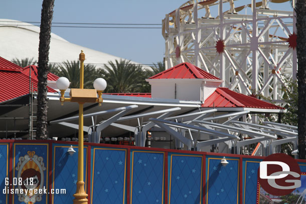 Supports for the queue shade structure are visible.