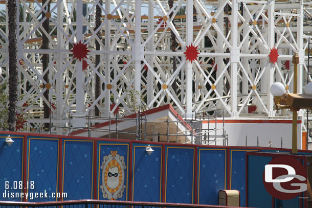 Guessing the front structure is for FastPass/the entrance?  And beyond it is the Cookie building.