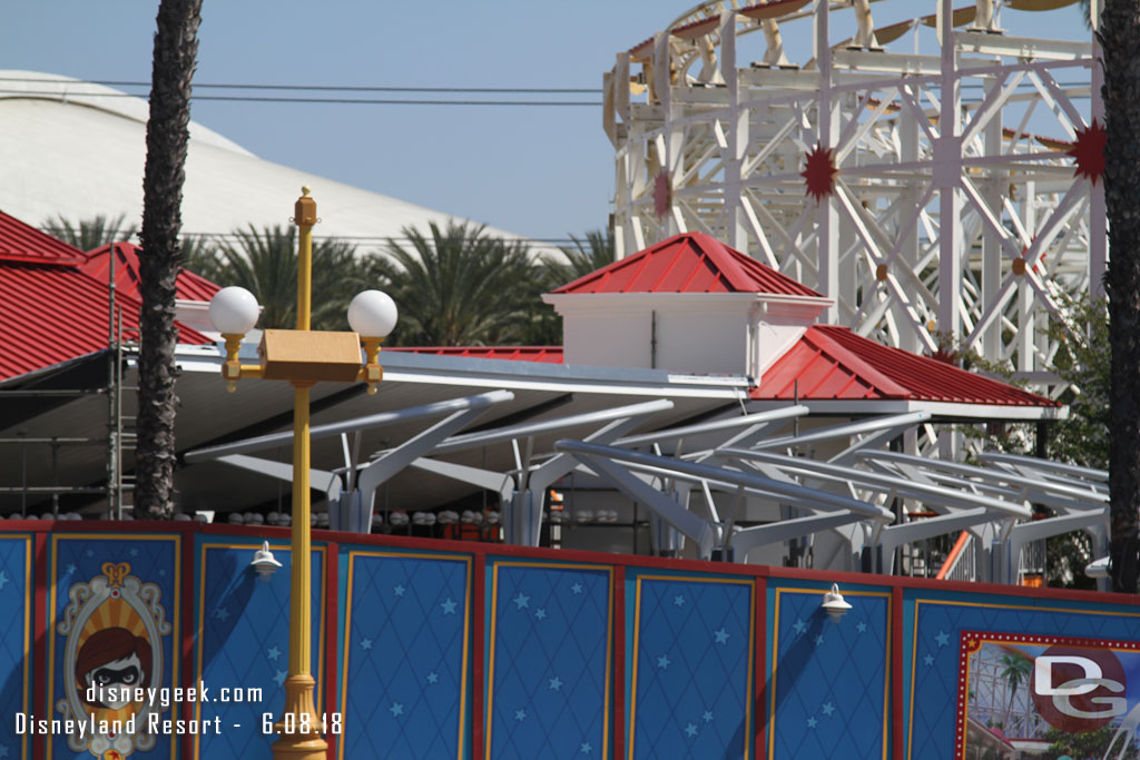 Supports for the queue shade structure are visible.