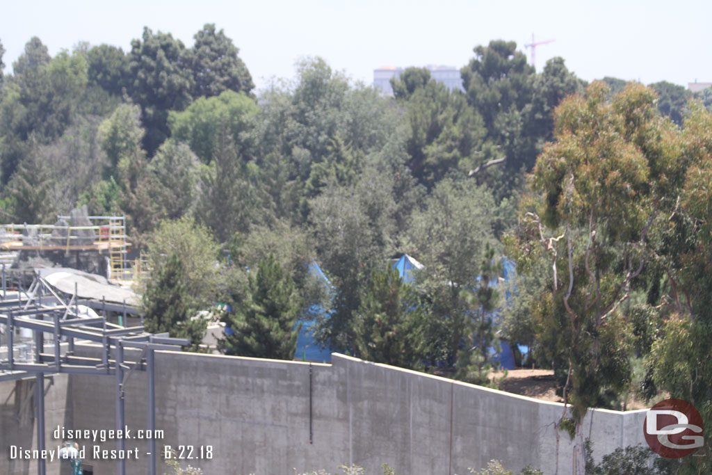 The blue tarp is still up.