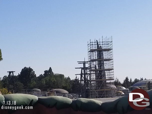 The tops of some of the Black Spire Outpost buildings are visible and more spires are rising above the village.