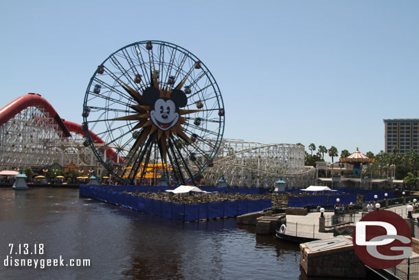 Two World of Color platforms are raised and have a fence around them as the renovation project continues.