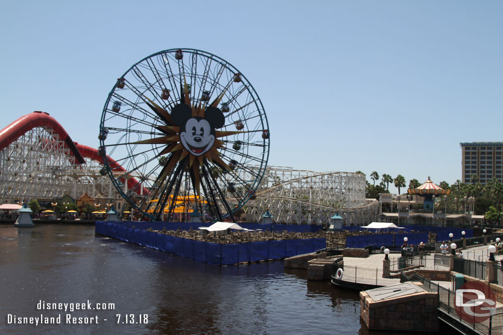 Two World of Color platforms are raised and have a fence around them as the renovation project continues.