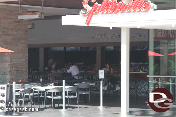 Almost all the tables were empty. Only a couple guests on the far side were visible.