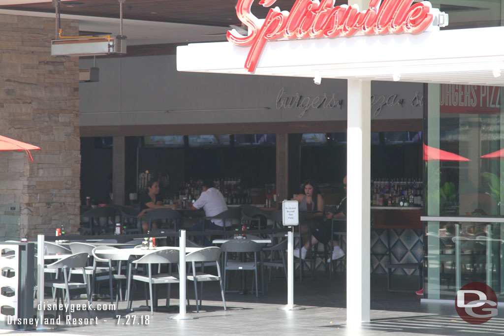 Almost all the tables were empty. Only a couple guests on the far side were visible.