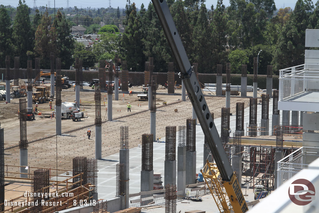 A closer look at a recently poured section and next to it the preparations for the next two sections are underway with one being leveled and the middle one the rebar in place.