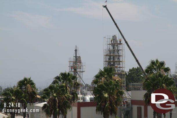 Crews working on installing scaffolding and on the wire mesh for the background spires.