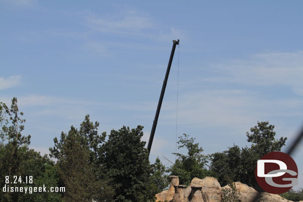 A crane on the far side of the site.