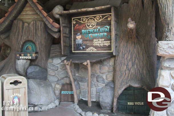 Sammy from the Country Bear Jamboree has set up a recycling corner.