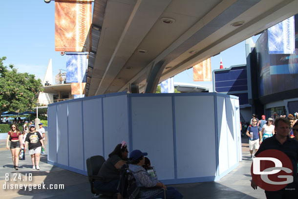 Work going on in Tomorrowland.  Assuming they are removing the seating and reducing the footprint of the support column to open the walkway more.