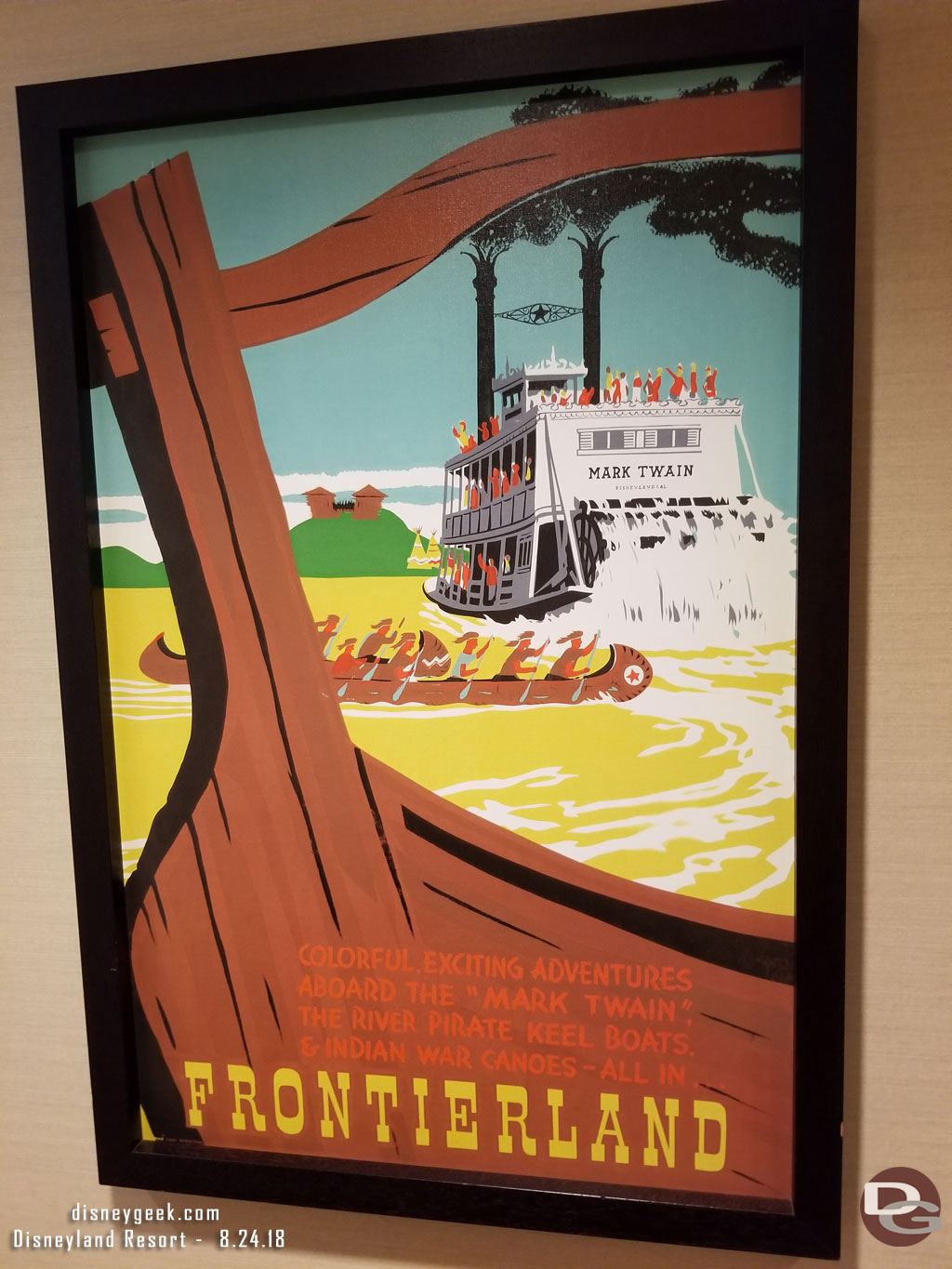 Frontierland attraction posters near the restrooms.