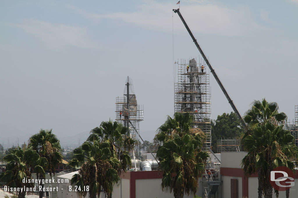 Crews working on installing scaffolding and on the wire mesh for the background spires.