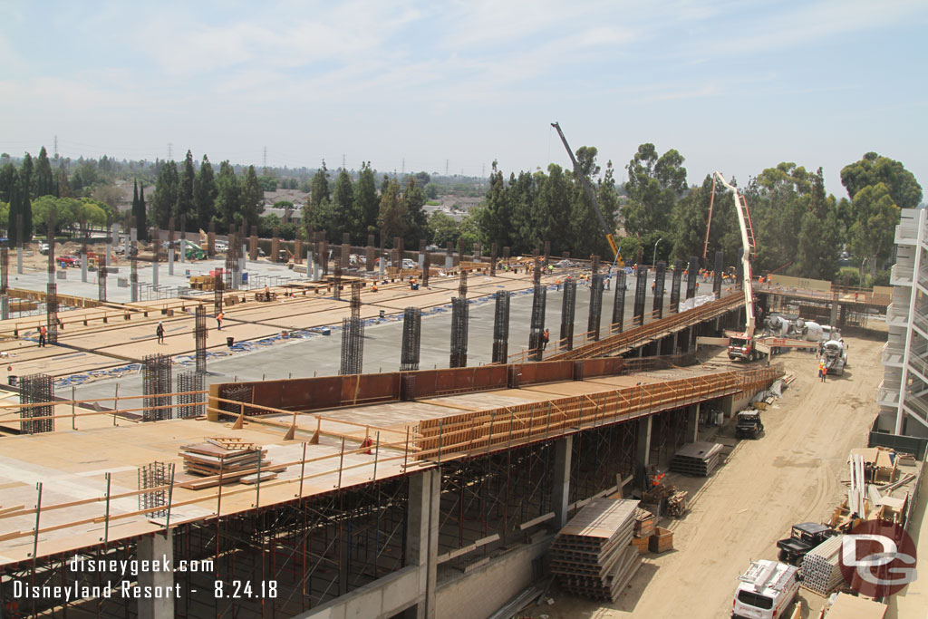 Here you can see the forms for the second ramp in the foreground.  In the background a truck pumping concrete for the 2nd floor.