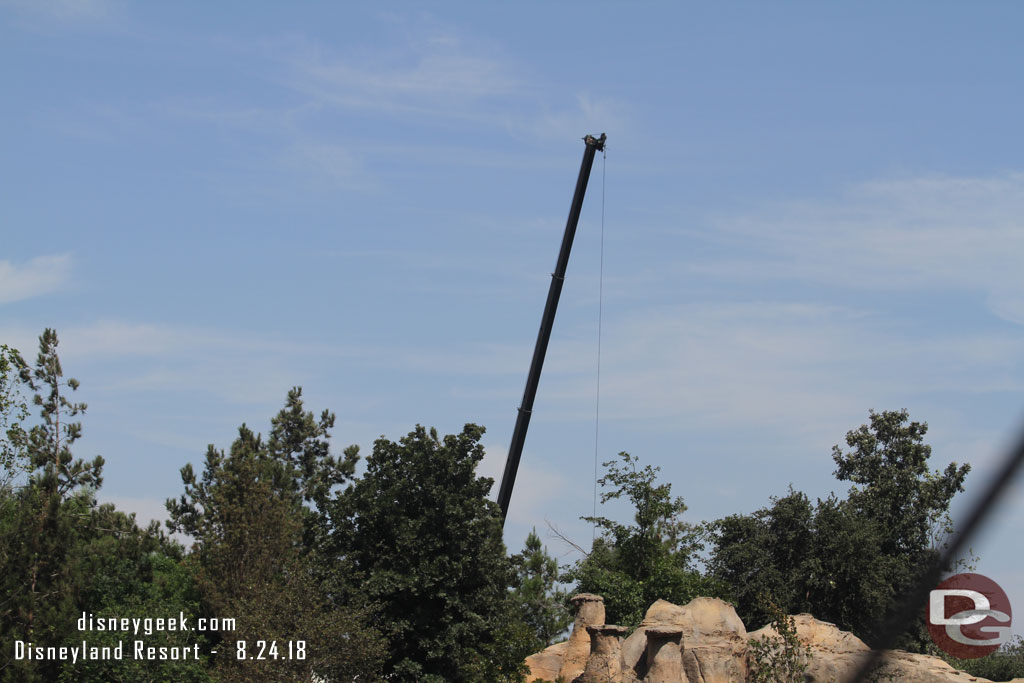 A crane on the far side of the site.