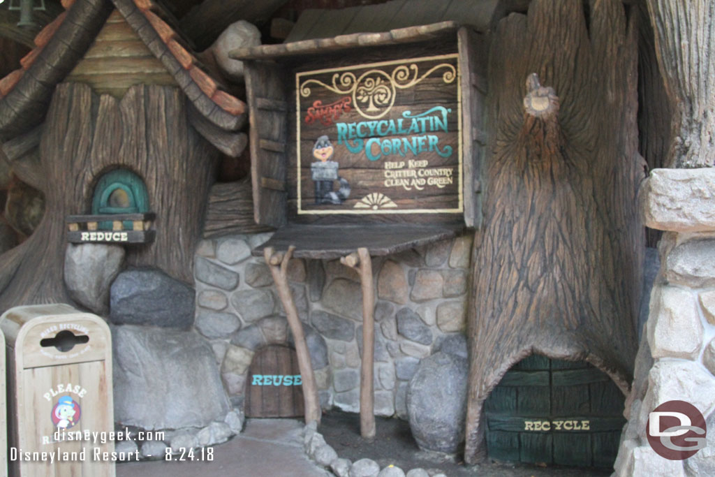 Sammy from the Country Bear Jamboree has set up a recycling corner.