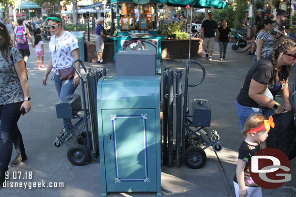 The walls are down from the planter removal project near the DVC stand.  The planter is gone but looks like a light post will be going back. For now trash cans are there and looks to be a staging area for extended queue poles.