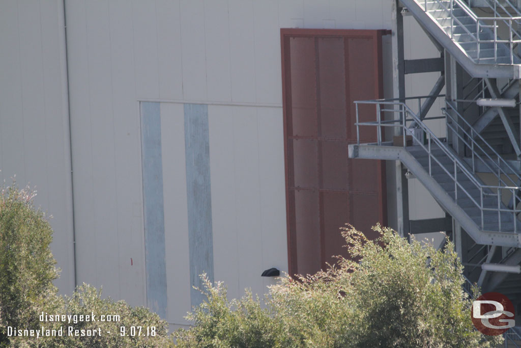 No visible progress on the paneling that filled in the access hole on the Battle Escape Building along Disneyland Drive.