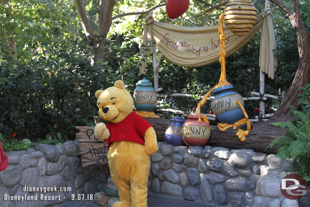 Winnie the Pooh greeting guests.