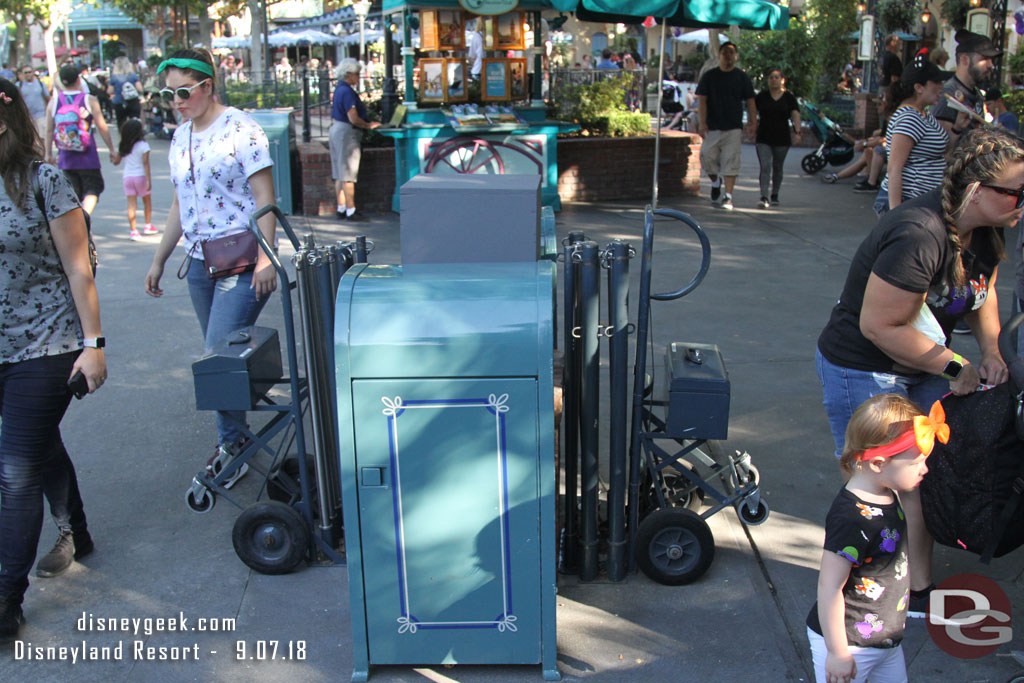 The walls are down from the planter removal project near the DVC stand.  The planter is gone but looks like a light post will be going back. For now trash cans are there and looks to be a staging area for extended queue poles.