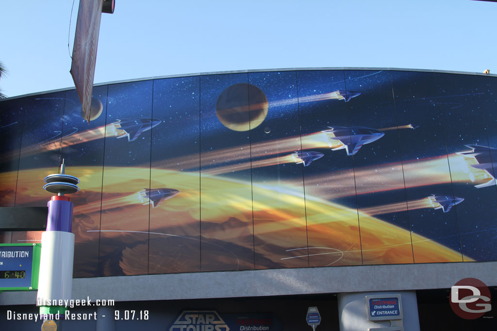 The mural on the north side of Tomorrowland is back.