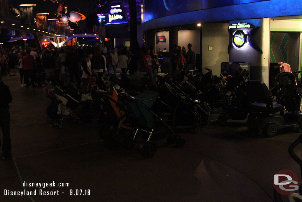 Stroller parking.. notice the line and how a majority are outside the designated area.  Cast Members showed up and started to move them all into the area.