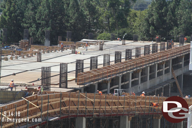 In the back half of the nearest section supports are up and decking is going in to support the third floor.