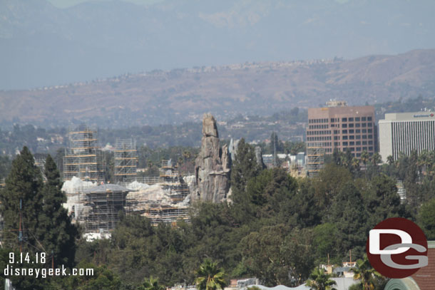 Star Wars: Galaxy's Edge rising in the distance.