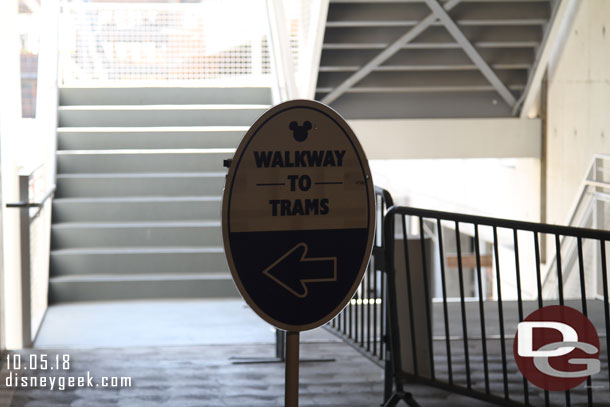 A sign by a staircase in the Mickey and Friends Parking structure to guide you.