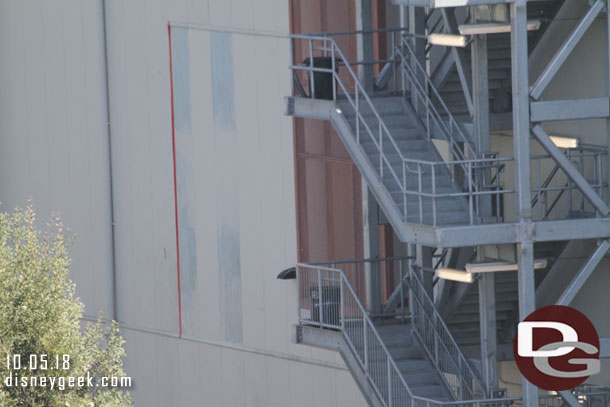 The panels that were inserted to fill in the access hole on the side of the large show building look like they are being painted.