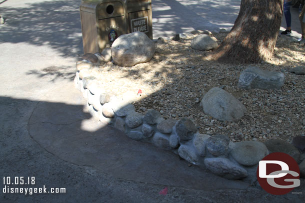 In Frontierland some walls have been removed.  The planter shrinking projects have wrapped up.  Here you can see some new pavement where the planter used to go to.