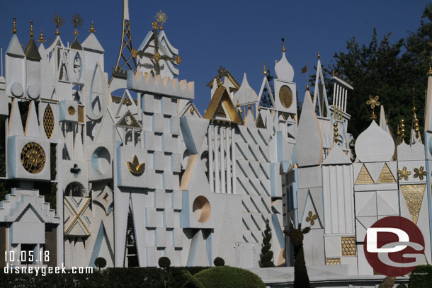 More preparations for the holiday lights are visible on the small world facade.