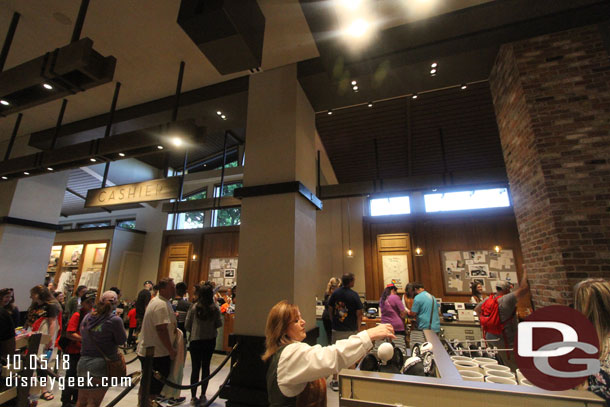 Cashiers are in the center of the section on the side nearest the trams.