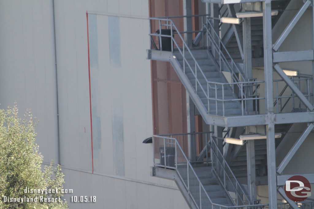 The panels that were inserted to fill in the access hole on the side of the large show building look like they are being painted.