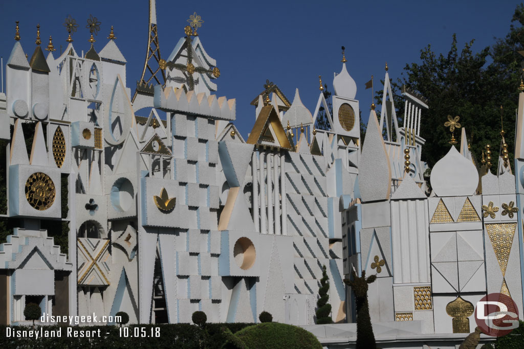 More preparations for the holiday lights are visible on the small world facade.