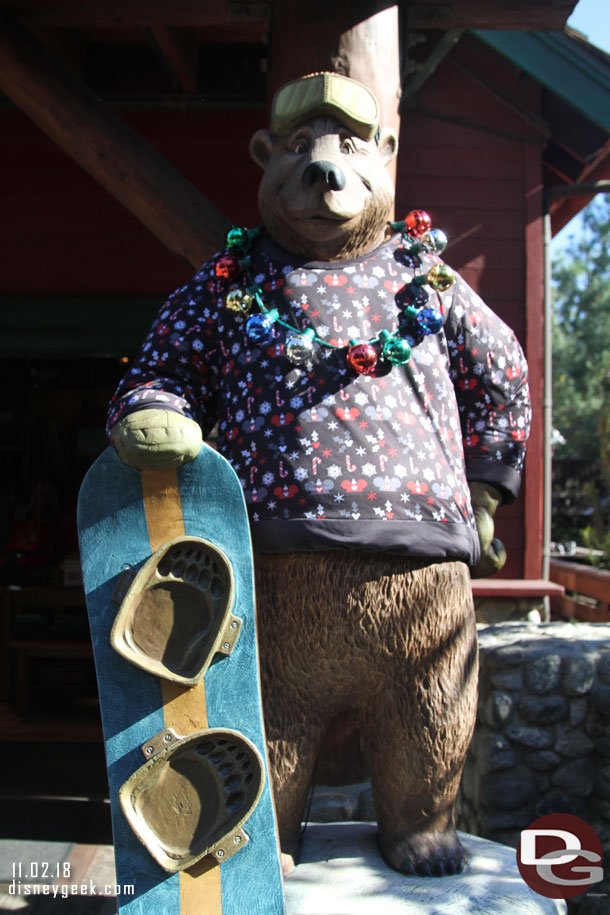 The bears at the entrance to Rushin' River Outfitters are decked out for the season.  A bear wearing a sweater in 90 degree weather helps to set the Christmas mood.